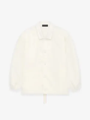 Fear of God Essentials Coaches Jacket in Cloud Dancer